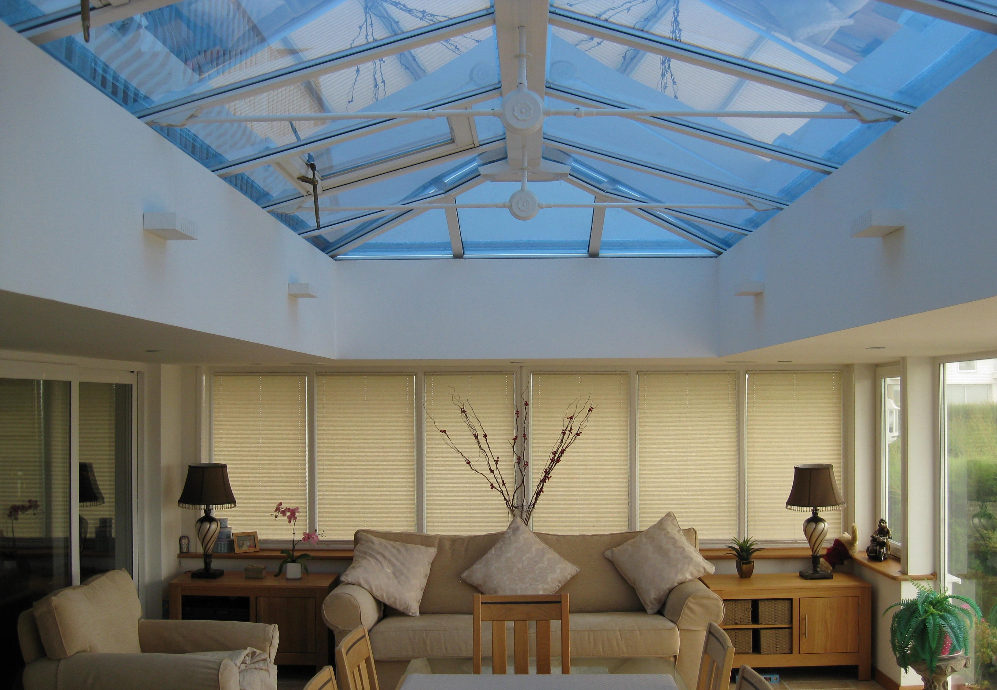 Glass conservatory with professional window film installed by TwilightTint West Sussex